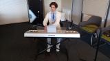 A student playing one of the Ukrainian melodies on the keyboard